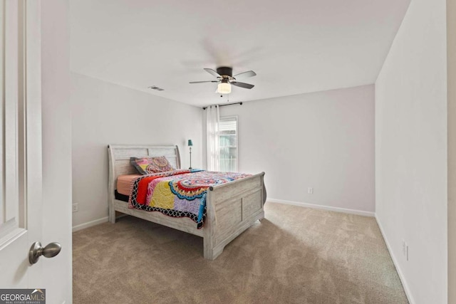 bedroom featuring light carpet and ceiling fan