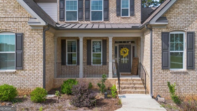 doorway to property with covered porch