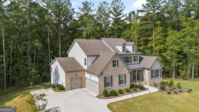 view of front of house with a front yard and a garage