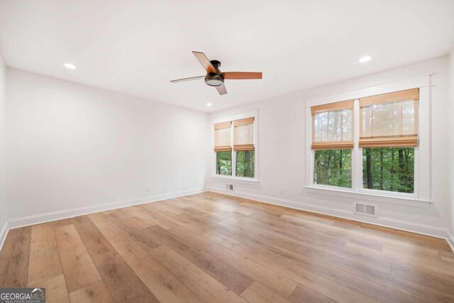 spare room featuring ceiling fan and light wood-type flooring