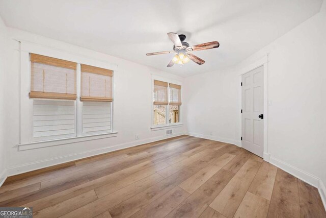 unfurnished room featuring ceiling fan and light hardwood / wood-style floors