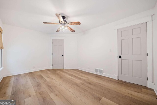 unfurnished room with ceiling fan and light hardwood / wood-style floors