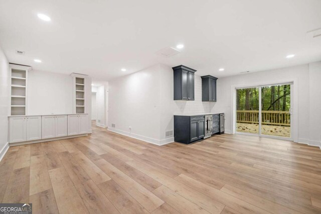 unfurnished living room featuring light hardwood / wood-style floors