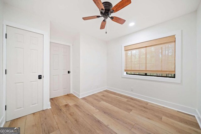 unfurnished bedroom featuring ceiling fan and light hardwood / wood-style floors