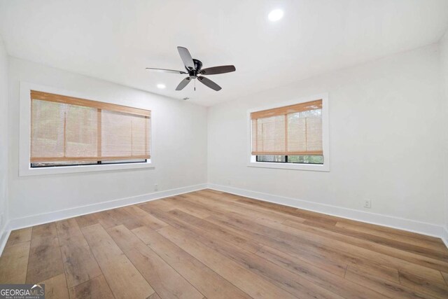 unfurnished room featuring ceiling fan and light hardwood / wood-style floors