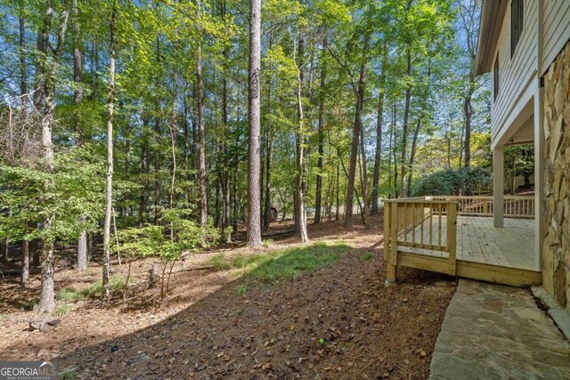 view of yard featuring a wooden deck