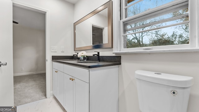 bathroom with vanity and toilet