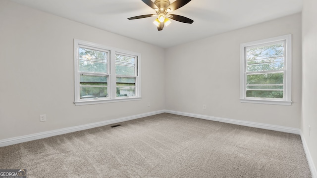 carpeted empty room with ceiling fan