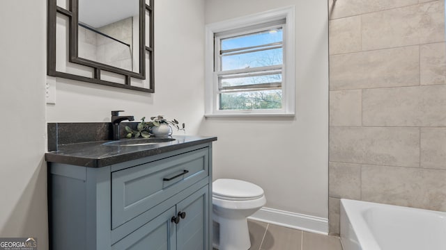 full bathroom featuring tile patterned floors, vanity, toilet, and tiled shower / bath combo