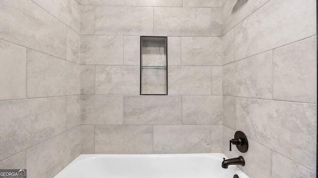 interior details with tiled shower / bath