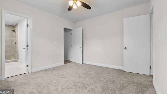 unfurnished bedroom with ensuite bath, ceiling fan, and light colored carpet