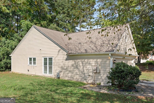 rear view of property featuring a yard