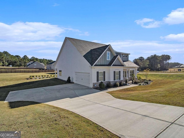 view of front of home with a garage and a front yard