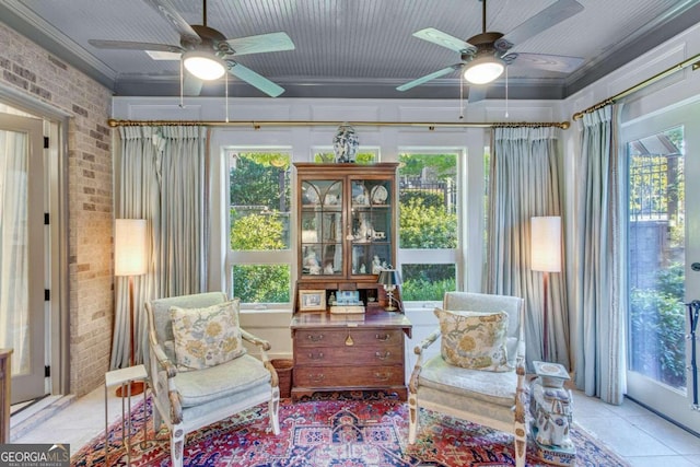 sunroom / solarium with a wealth of natural light and ceiling fan