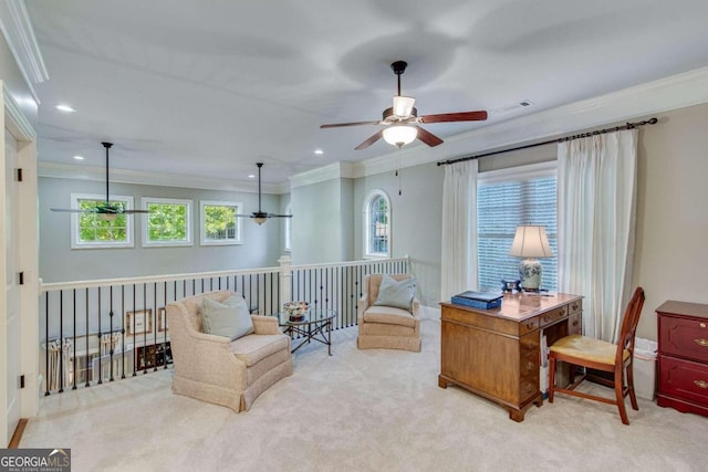 living area featuring crown molding, a wealth of natural light, light colored carpet, and ceiling fan