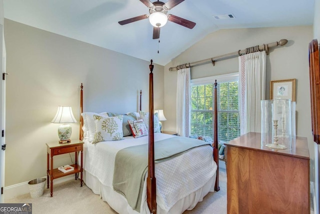 bedroom featuring ceiling fan, lofted ceiling, and light colored carpet