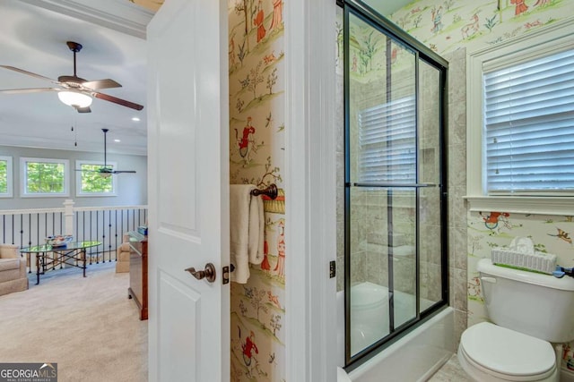 bathroom featuring toilet, crown molding, shower / bath combination with glass door, and ceiling fan