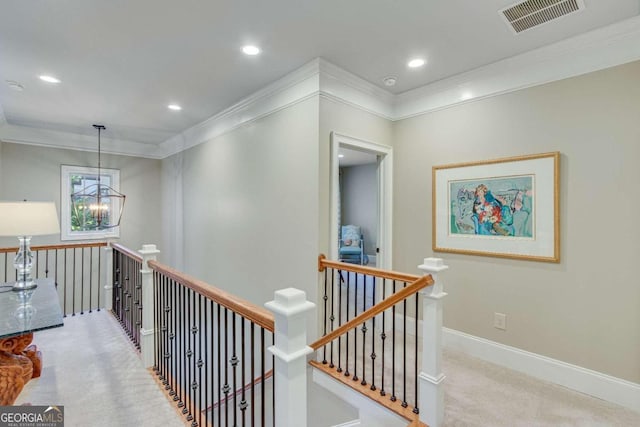 hallway featuring light carpet, a notable chandelier, and ornamental molding