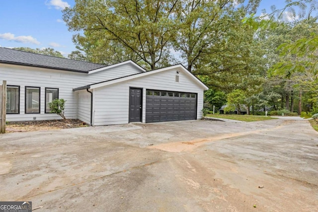 view of side of property with a garage