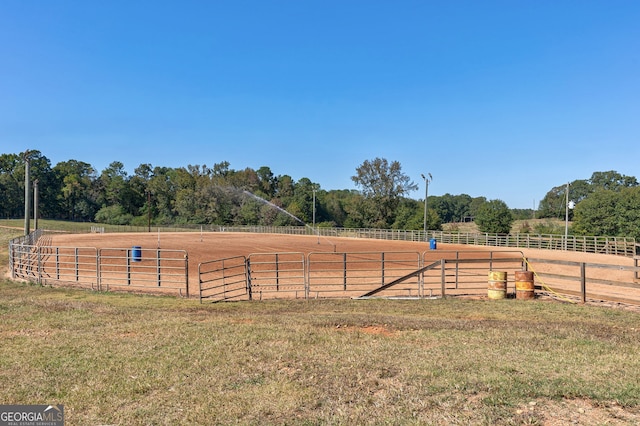 view of yard with a rural view