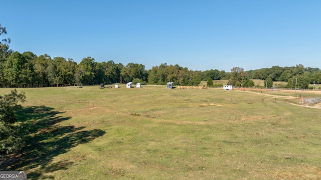 view of yard with a rural view