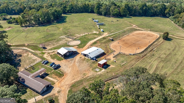 birds eye view of property with a rural view