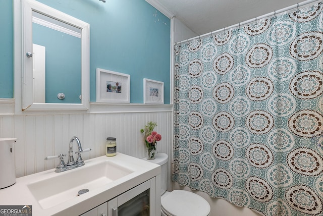 bathroom with toilet, ornamental molding, a shower with shower curtain, vanity, and a textured ceiling