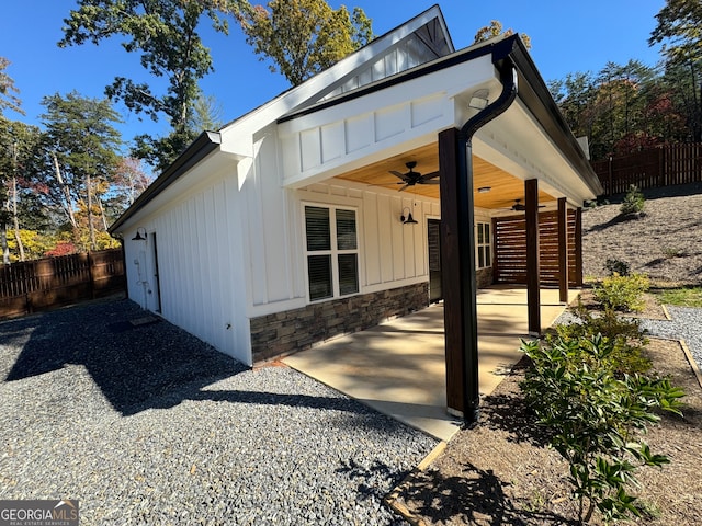 view of front of property with a patio and ceiling fan