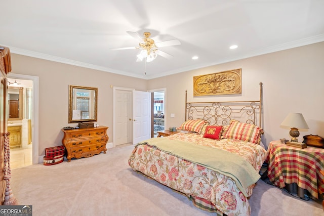 bedroom with crown molding, ensuite bathroom, light colored carpet, and ceiling fan