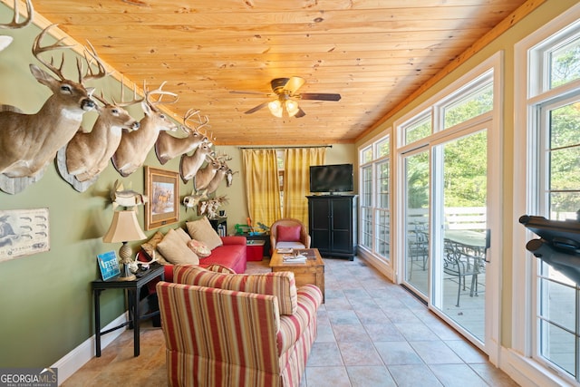 living room featuring light tile patterned flooring, wood ceiling, and ceiling fan