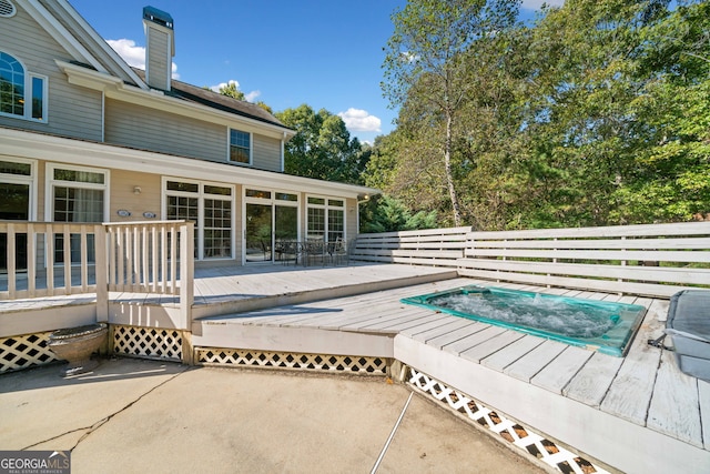 view of swimming pool with a deck