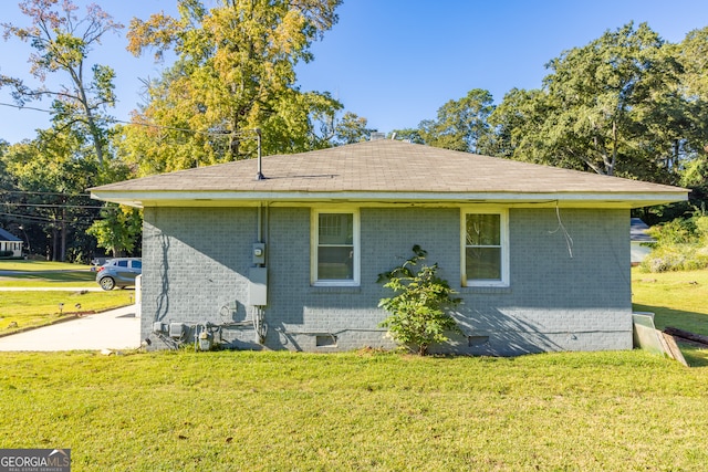 view of property exterior featuring a lawn