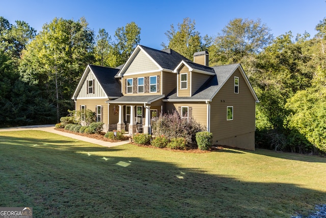 view of front of home featuring a front lawn and covered porch