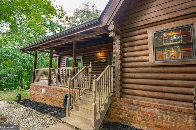 doorway to property with a porch