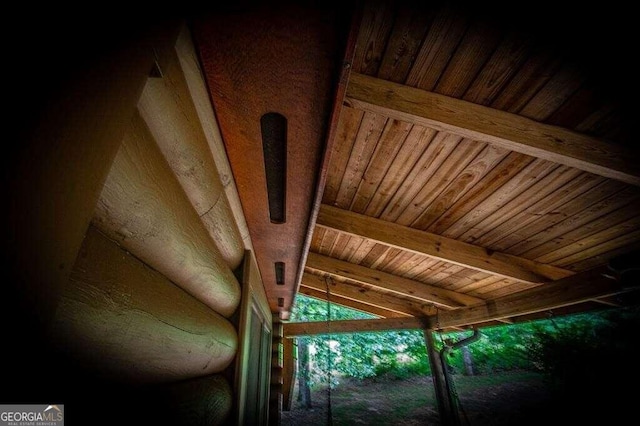 details featuring beamed ceiling and wooden ceiling