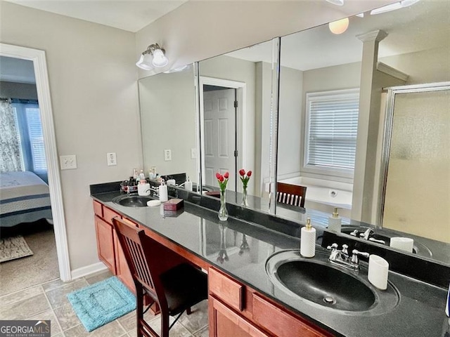 bathroom with vanity, a shower with shower door, and tile patterned flooring