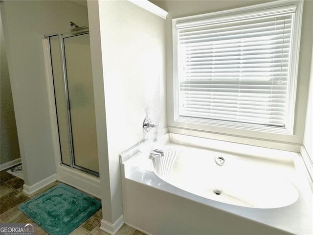 bathroom featuring plus walk in shower