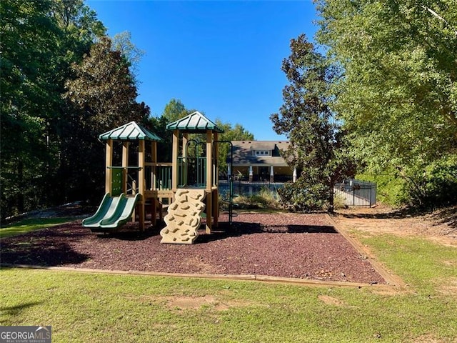 view of jungle gym with a yard