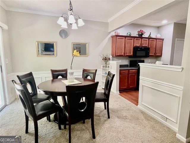 dining space featuring light carpet, a notable chandelier, and ornamental molding