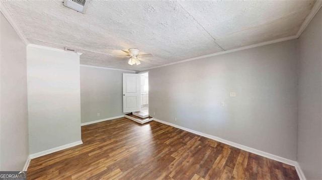 spare room with dark wood-type flooring, crown molding, a textured ceiling, and ceiling fan