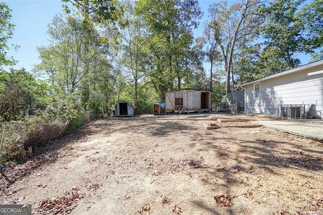 view of yard with a wooden deck