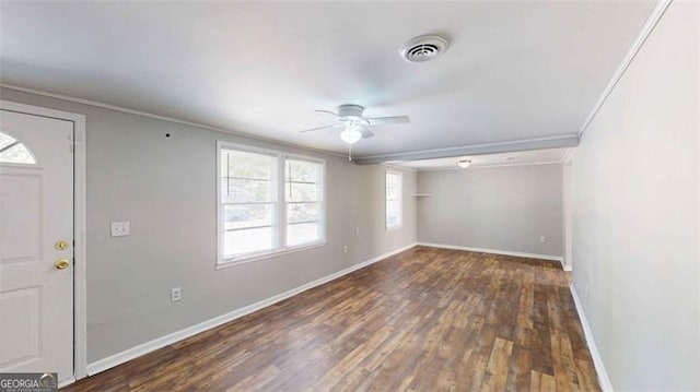 entryway with ceiling fan, ornamental molding, plenty of natural light, and dark hardwood / wood-style floors