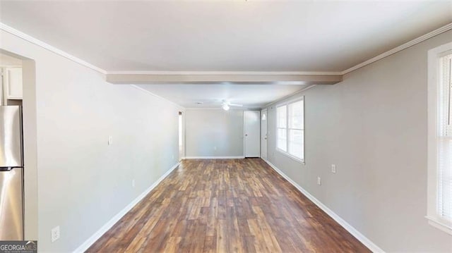 unfurnished room featuring crown molding, dark hardwood / wood-style floors, and ceiling fan