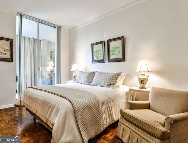 bedroom with crown molding and dark parquet floors