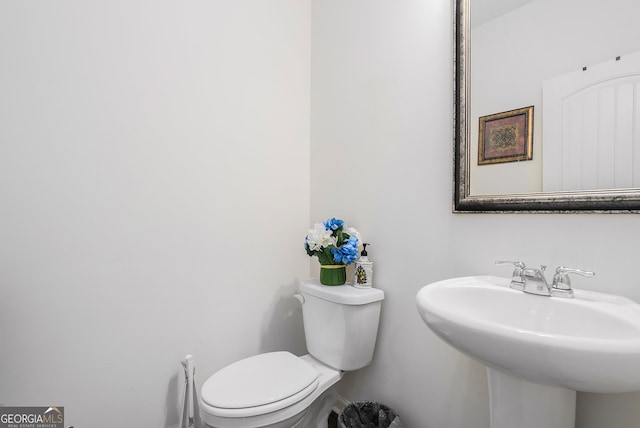 bathroom with toilet and sink