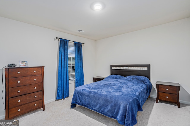 bedroom with light carpet