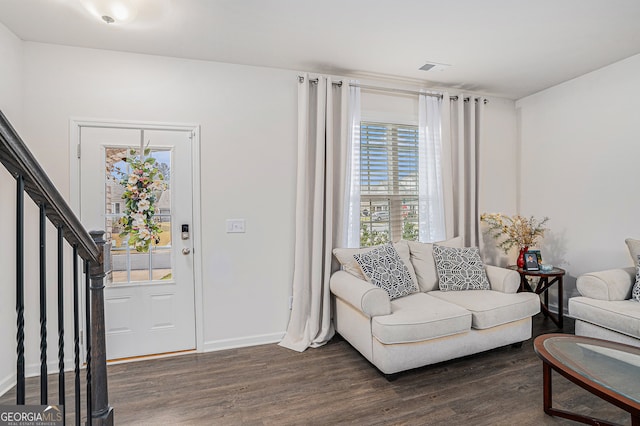 living room with dark hardwood / wood-style flooring