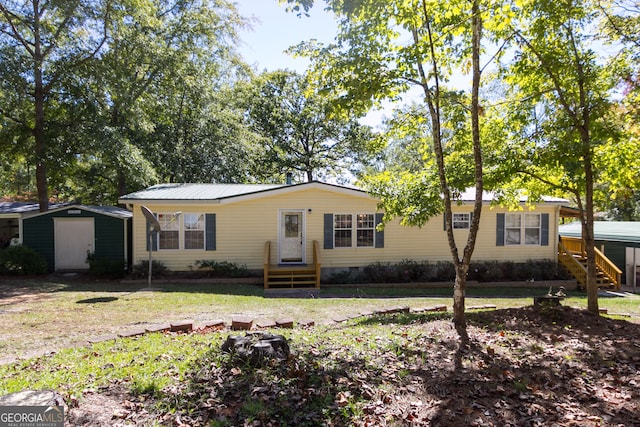 ranch-style house with a shed