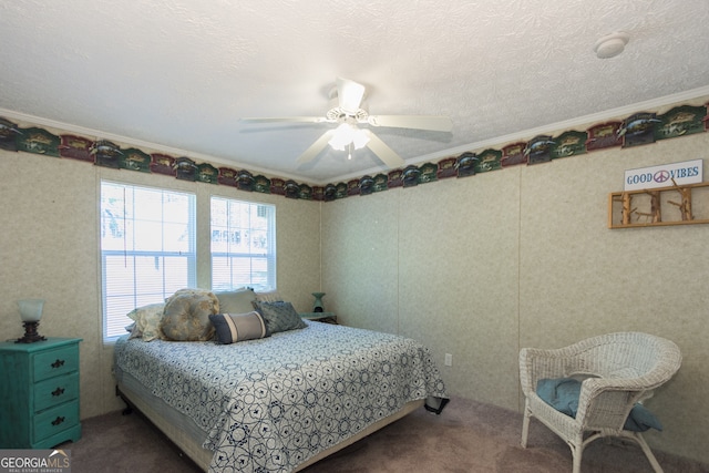 carpeted bedroom with crown molding, a textured ceiling, and ceiling fan