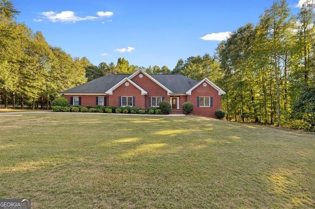 ranch-style house featuring a front lawn